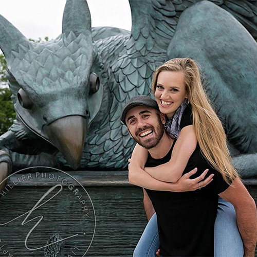 young couple in front of the Gryphon statue