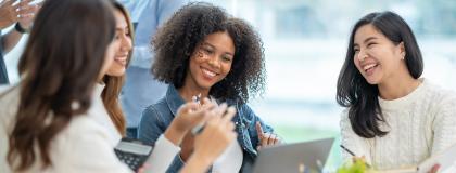 A group of young women laughing.