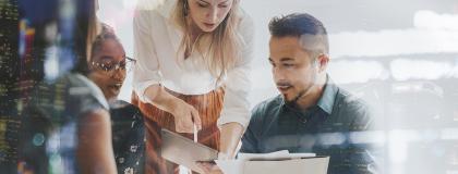 Small group of people working through a business plan.
