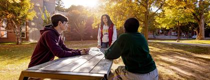 Two students and an RLS memebr talking outside North Residence