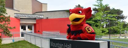 Gryphon standing outside the Mountain Hall Residence