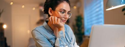 Woman studying on a laptop.
