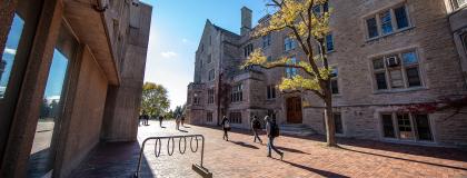 Students walking in between Johnston Hall and the Mackinnon building.