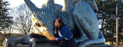 Ritika Gupta with the gulph gryphon statue