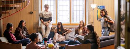 Students sitting and talking in Johnston Hall Lounge in Residence