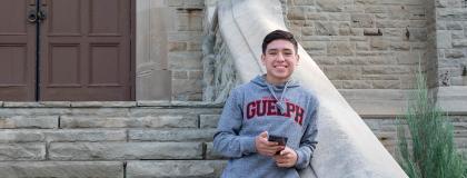 Male English Language Programs students in front of War Memorial Hall.