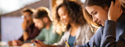 Row of students studying.