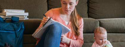 A student studying with their baby